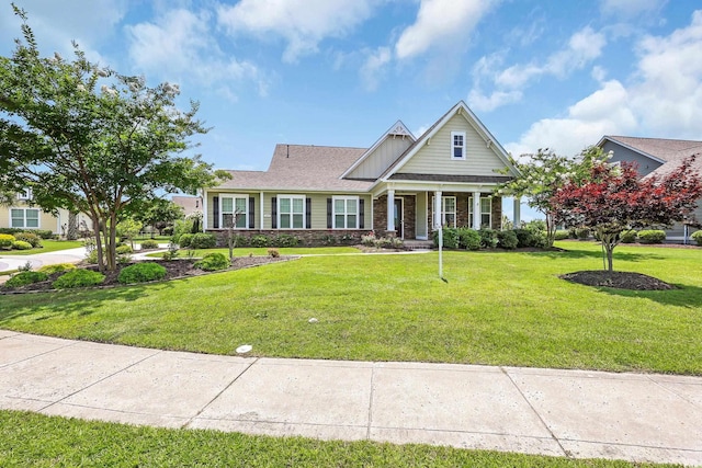 1405 Osprey Pointe Ln, North Myrtle Beach, SC 29582 - craftsman-style home featuring a front yard and covered porch