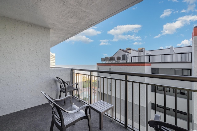 balcony featuring a water view