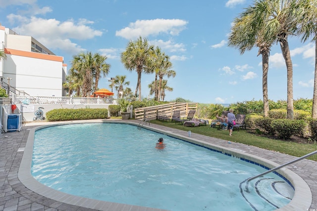 view of swimming pool featuring a fenced in pool and fence