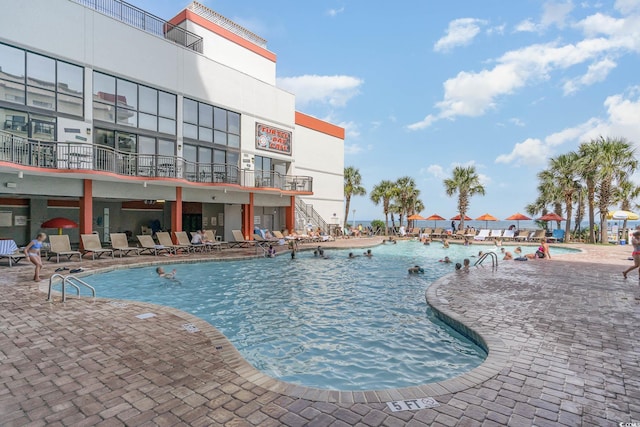 view of swimming pool featuring a patio