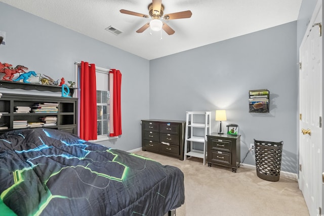 bedroom featuring ceiling fan and light colored carpet