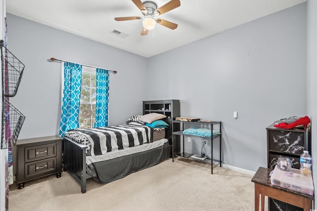 carpeted bedroom with ceiling fan