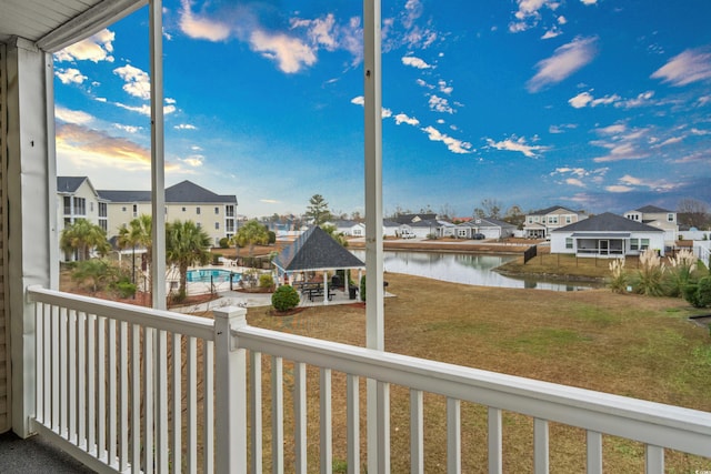 balcony featuring a water view