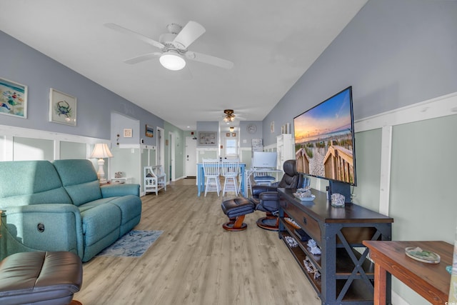 living room with light wood-type flooring and ceiling fan