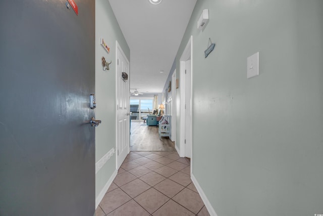 hallway with light tile patterned floors