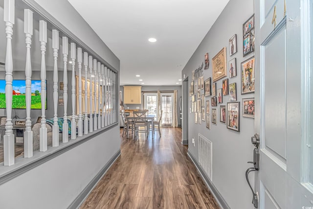 hallway with dark wood-type flooring