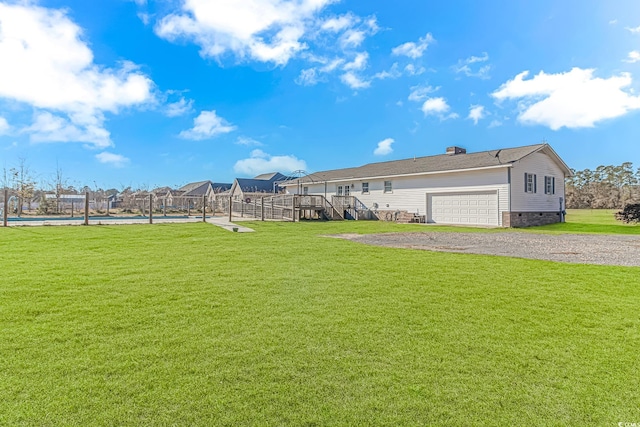 view of yard featuring a swimming pool side deck