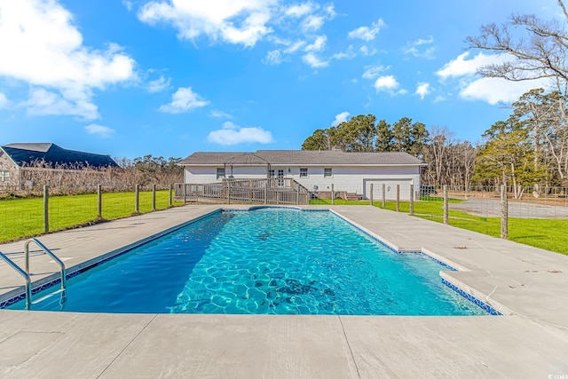 view of pool featuring a lawn and a patio area