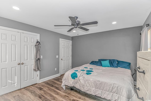 bedroom with ceiling fan and wood-type flooring