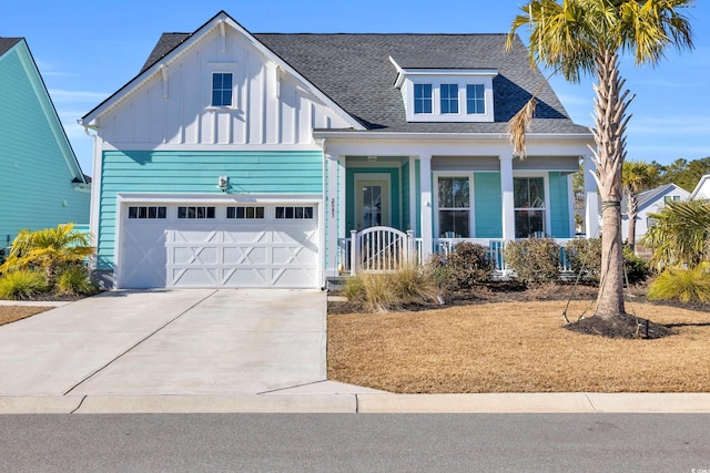 view of front facade with a porch and a garage