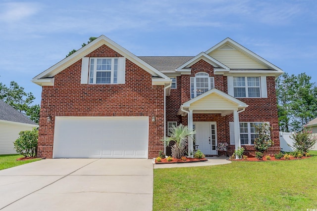 view of front facade with a garage and a front lawn