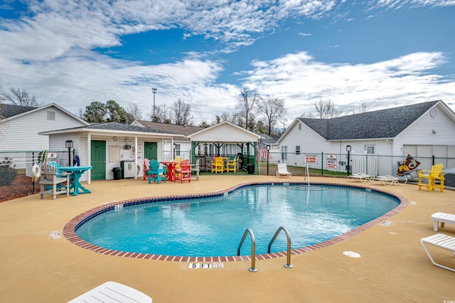 view of swimming pool with a patio area