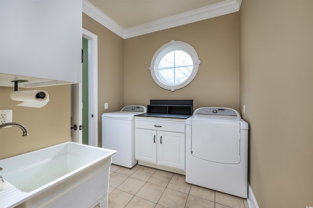 laundry room with washer and clothes dryer, cabinets, sink, light tile patterned floors, and ornamental molding