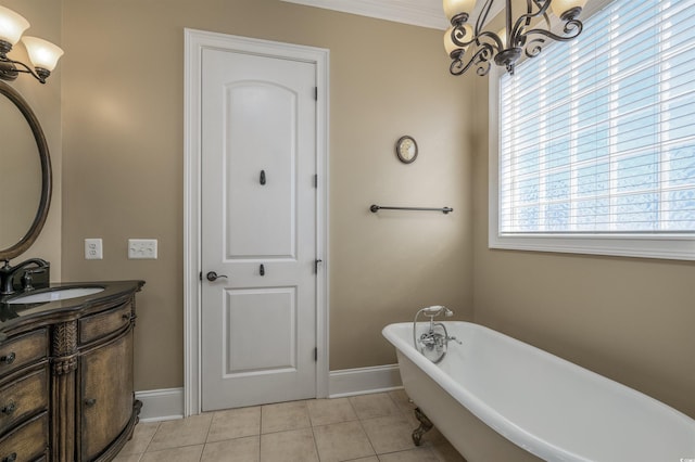 bathroom featuring vanity, a tub to relax in, tile patterned floors, and a wealth of natural light