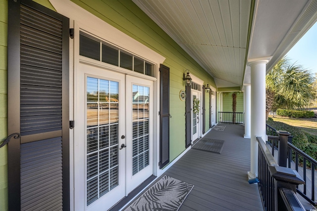 deck featuring covered porch and french doors