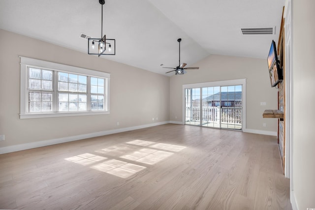 unfurnished living room featuring lofted ceiling, light wood finished floors, baseboards, and visible vents