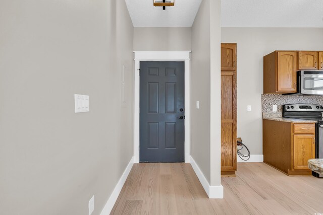 entryway with light wood-type flooring