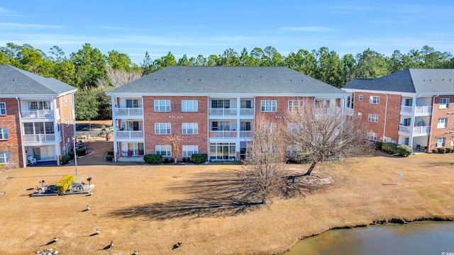 view of building exterior featuring a water view