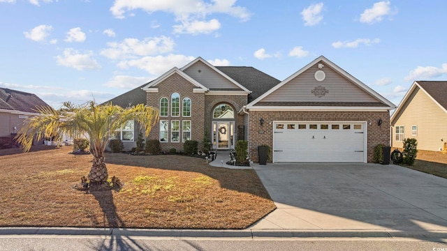 view of front property with a garage and a front lawn