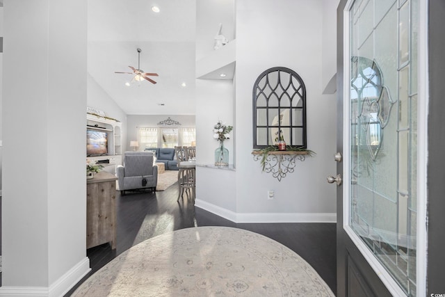 entrance foyer with dark hardwood / wood-style floors, ceiling fan, and high vaulted ceiling