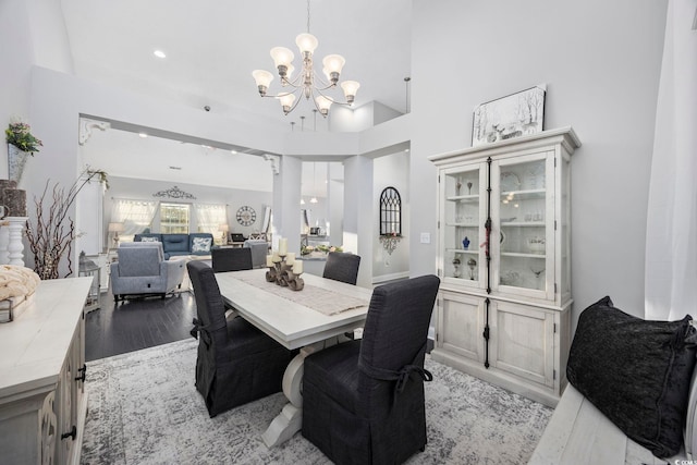 dining room with light hardwood / wood-style flooring and a chandelier