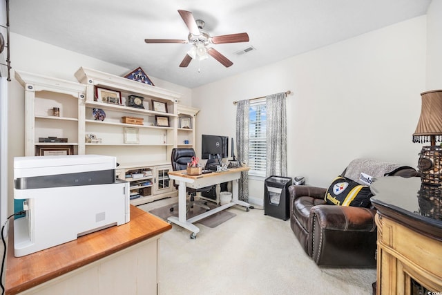 office with ceiling fan and light colored carpet