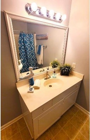 bathroom featuring tile patterned floors and vanity