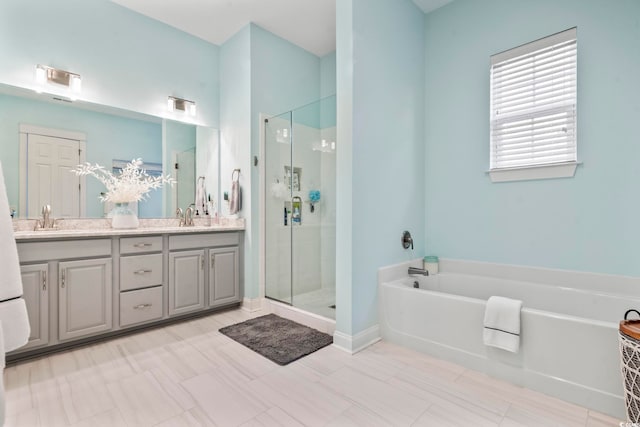 bathroom featuring tile patterned flooring, vanity, and separate shower and tub