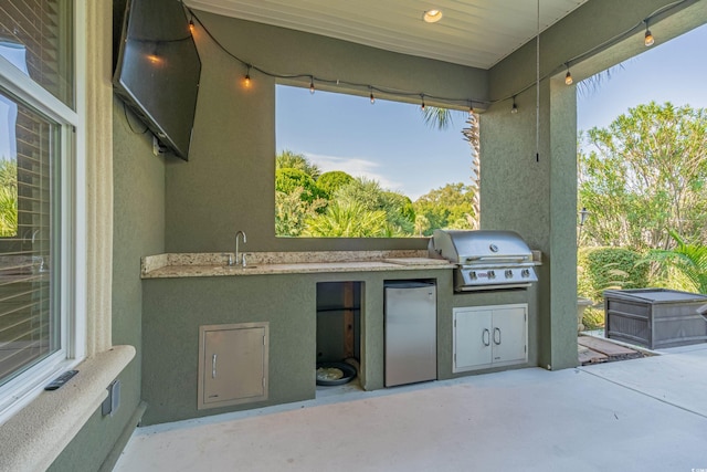 view of patio featuring a grill and exterior kitchen