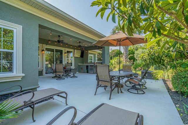 view of patio featuring ceiling fan