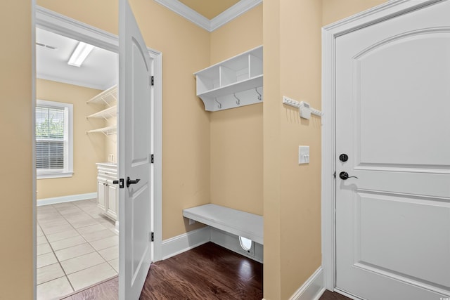 mudroom with light hardwood / wood-style floors and ornamental molding