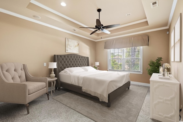 bedroom with ceiling fan, carpet floors, crown molding, and a tray ceiling