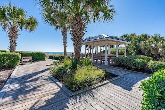 view of property's community with a gazebo and a water view