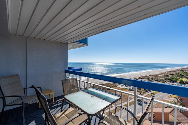 balcony with a view of the beach and a water view