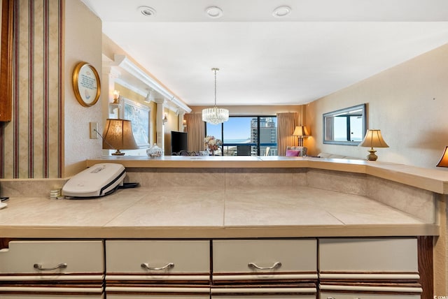 kitchen featuring a chandelier