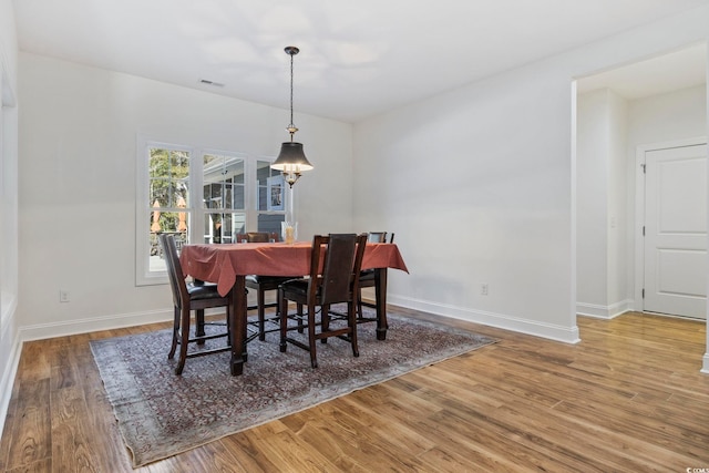 640 Fox Hollow Rd, Murrells Inlet, SC 29576 - dining room featuring wood finished floors and baseboards