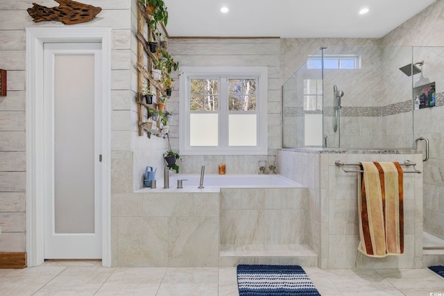 bathroom featuring recessed lighting, a garden tub, plenty of natural light, and a stall shower