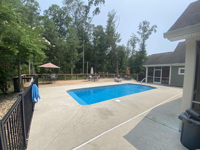 640 Fox Hollow Rd, Murrells Inlet, SC 29576 - view of pool with a patio, outdoor dining area, and a sunroom