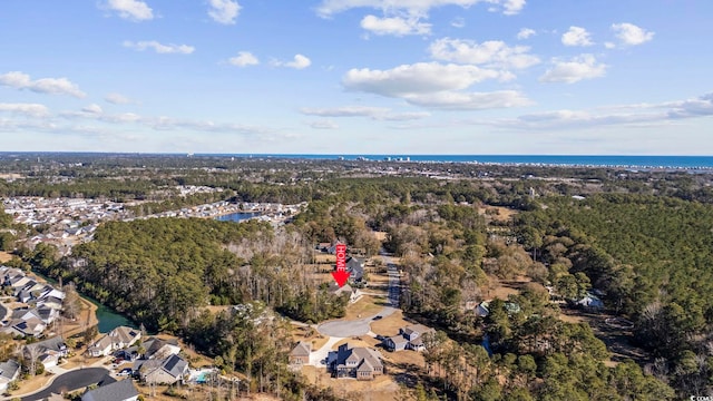 drone / aerial view featuring a water view and a residential view