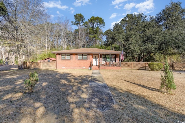 single story home with a porch