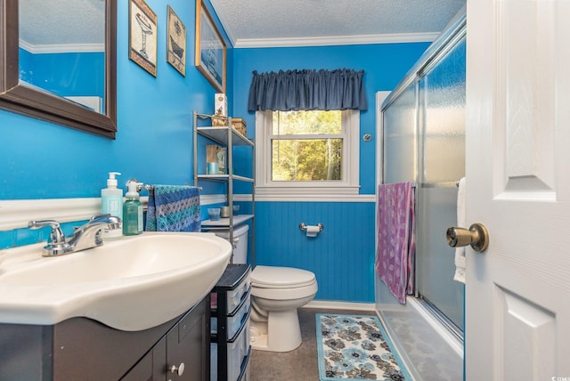 full bathroom featuring toilet, vanity, a textured ceiling, and ornamental molding