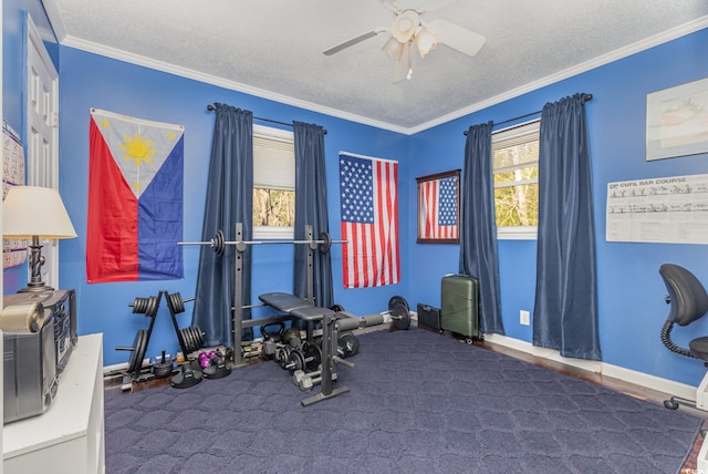 exercise room featuring a textured ceiling, ceiling fan, and ornamental molding