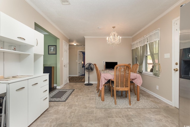 dining space with crown molding, a textured ceiling, and an inviting chandelier