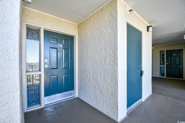 3601 S Ocean Blvd Unit 7-E, North Myrtle Beach, SC 29582 - view of exterior entry featuring stucco siding