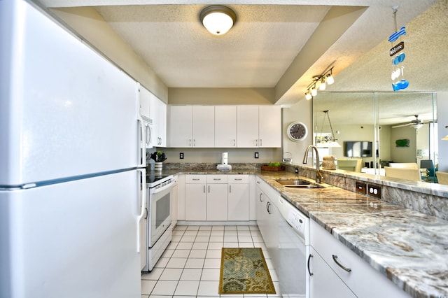 3601 S Ocean Blvd Unit 7-E, North Myrtle Beach, SC 29582 - kitchen featuring white appliances, light tile patterned floors, white cabinetry, a ceiling fan, and light stone counters