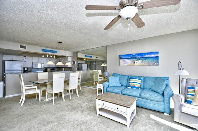 3601 S Ocean Blvd Unit 7-E, North Myrtle Beach, SC 29582 - carpeted living room with a textured ceiling and ceiling fan