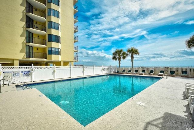 view of swimming pool featuring a patio area