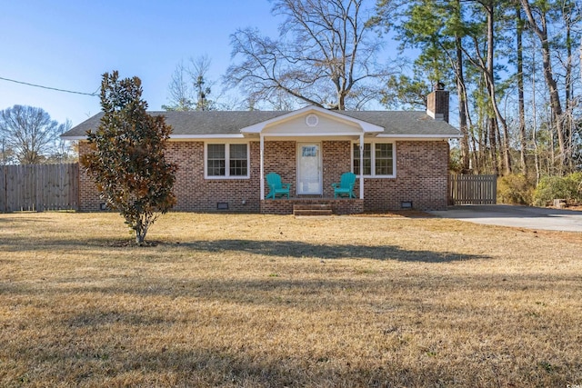 ranch-style home with a front lawn