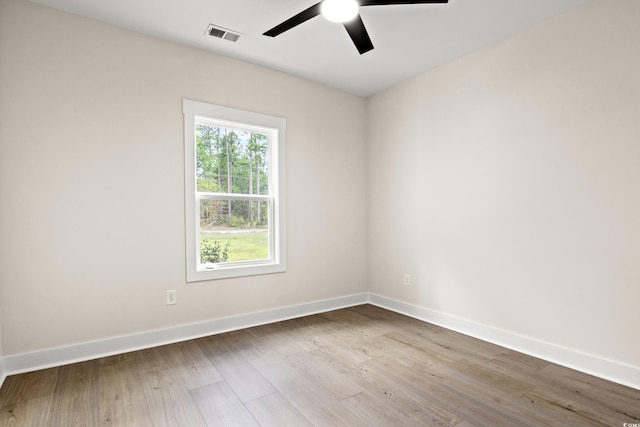 unfurnished room with ceiling fan and light hardwood / wood-style flooring