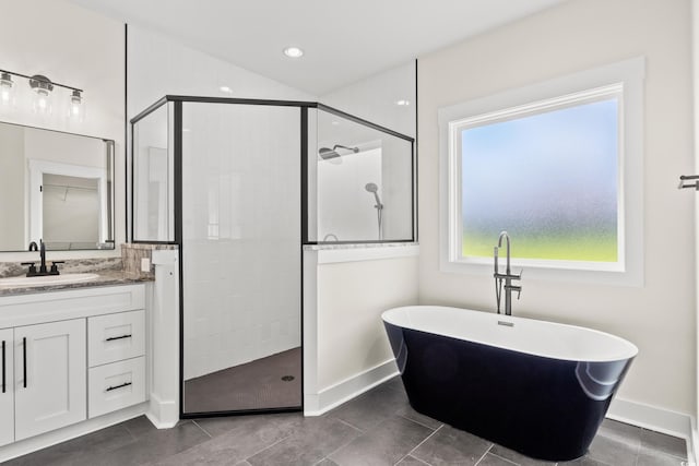 bathroom with tile patterned floors, vanity, and separate shower and tub